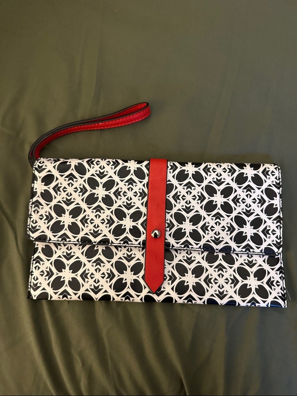 The Limited Black & White Patterned Wristlet Clutch with Red Accent